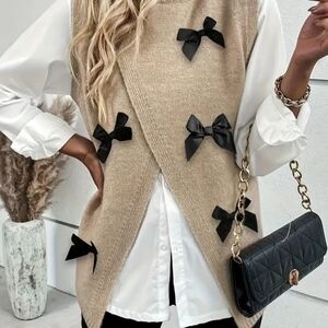 Elegant Beige Sweater with Black Bow Accents